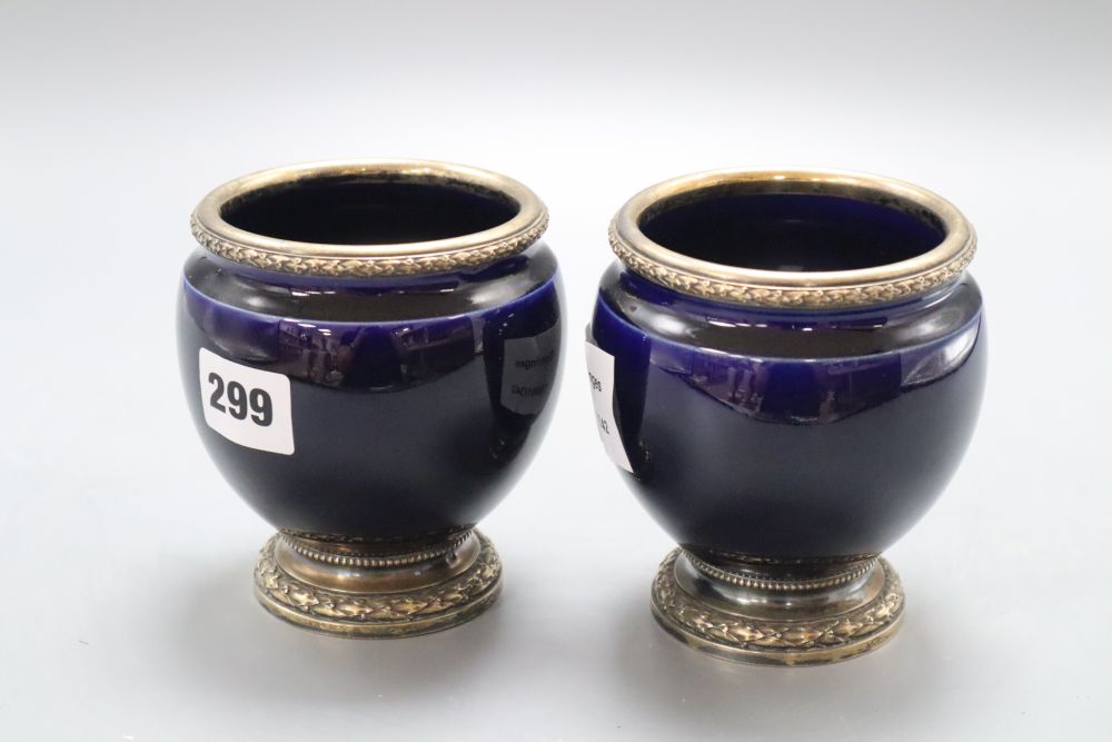 A pair of Risler & Carre silver mounted blue glazed squat vases, height 11cm